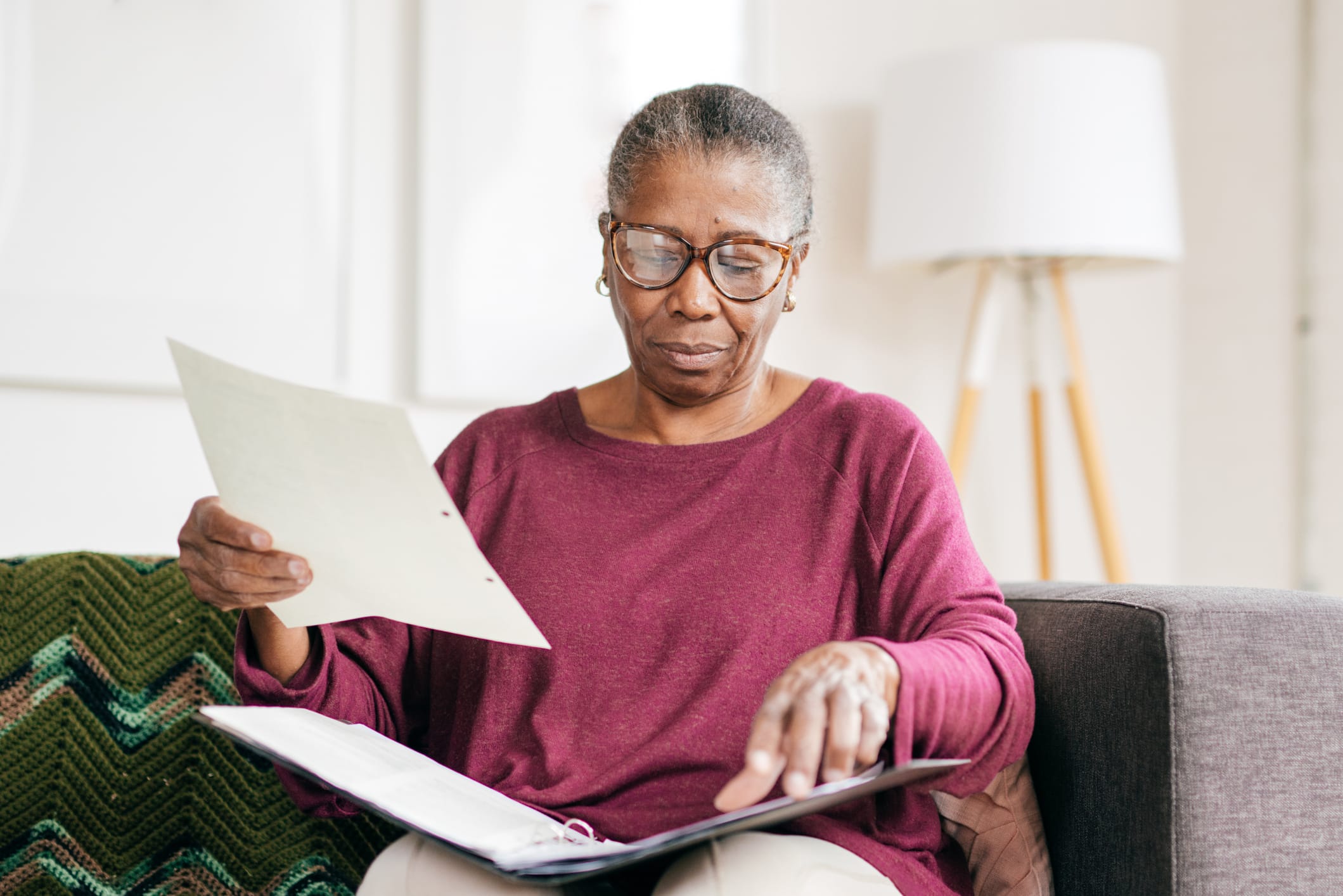 Older woman with binder of medical records