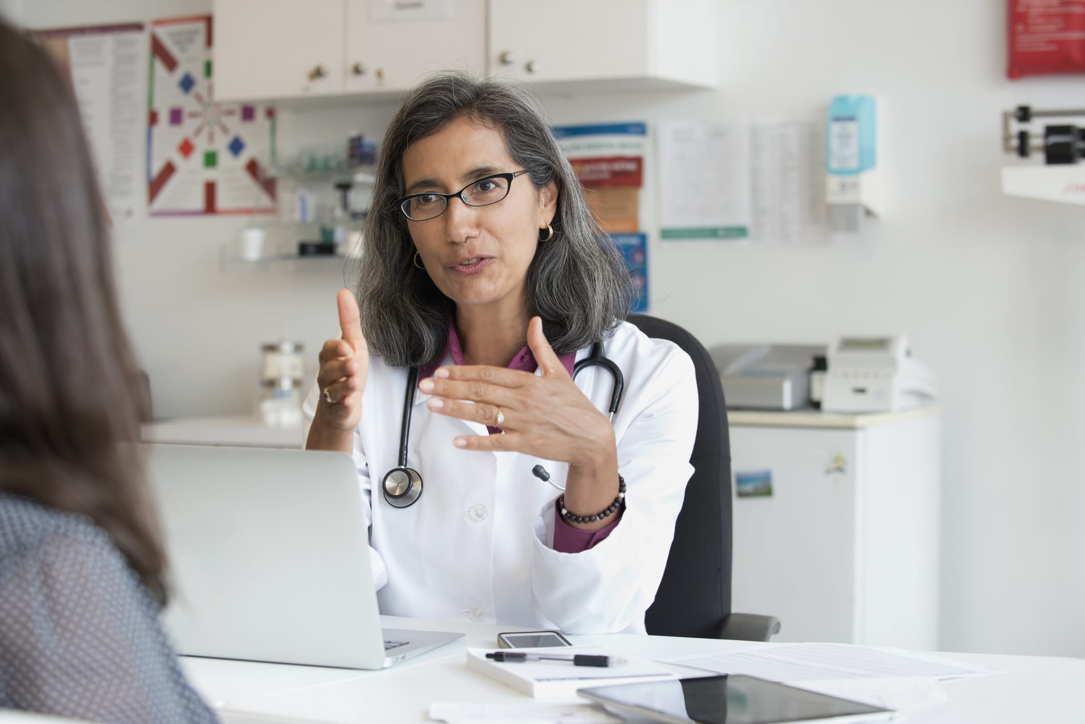 Female doctor talking to a patient