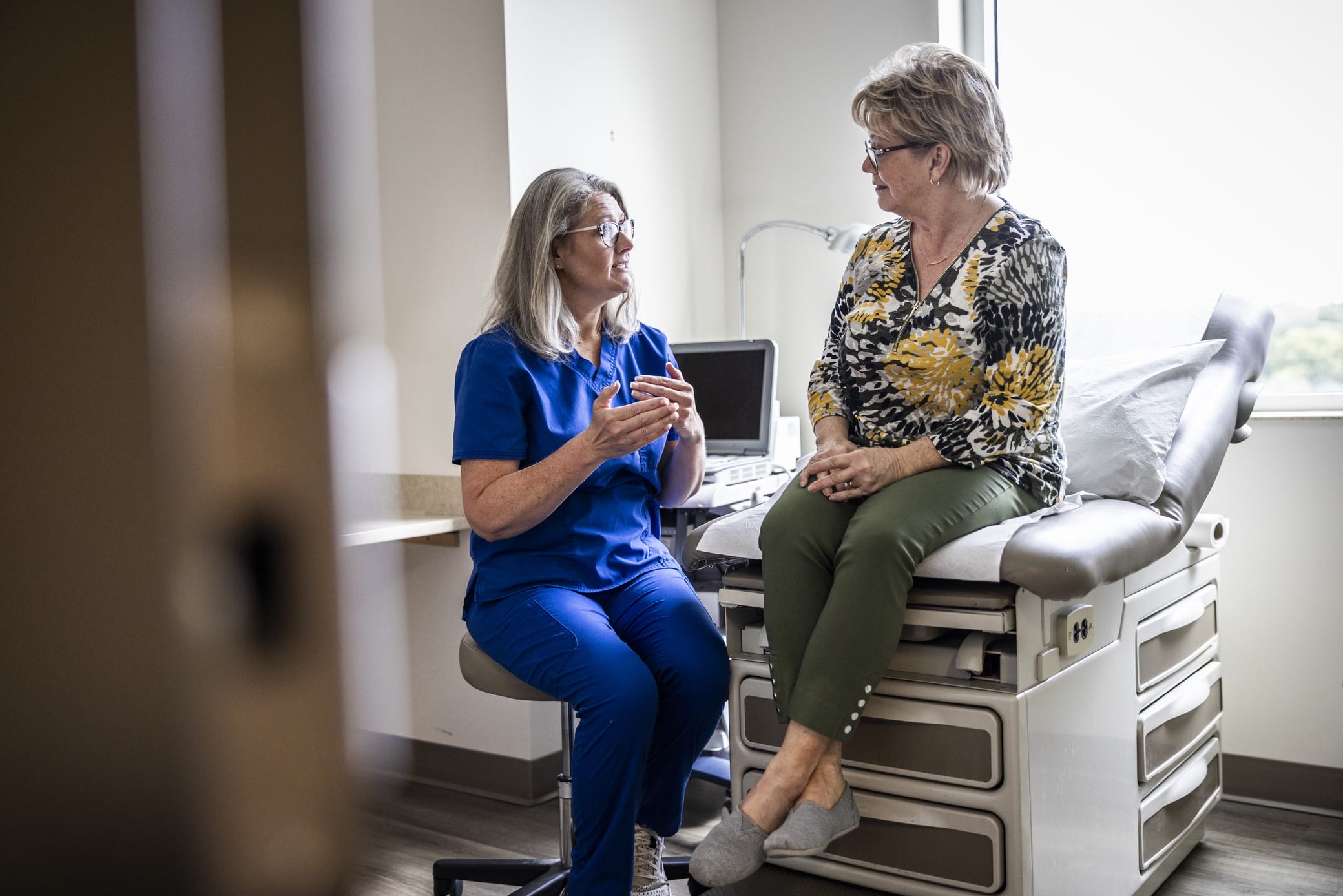 Older woman speaking with her doctor
